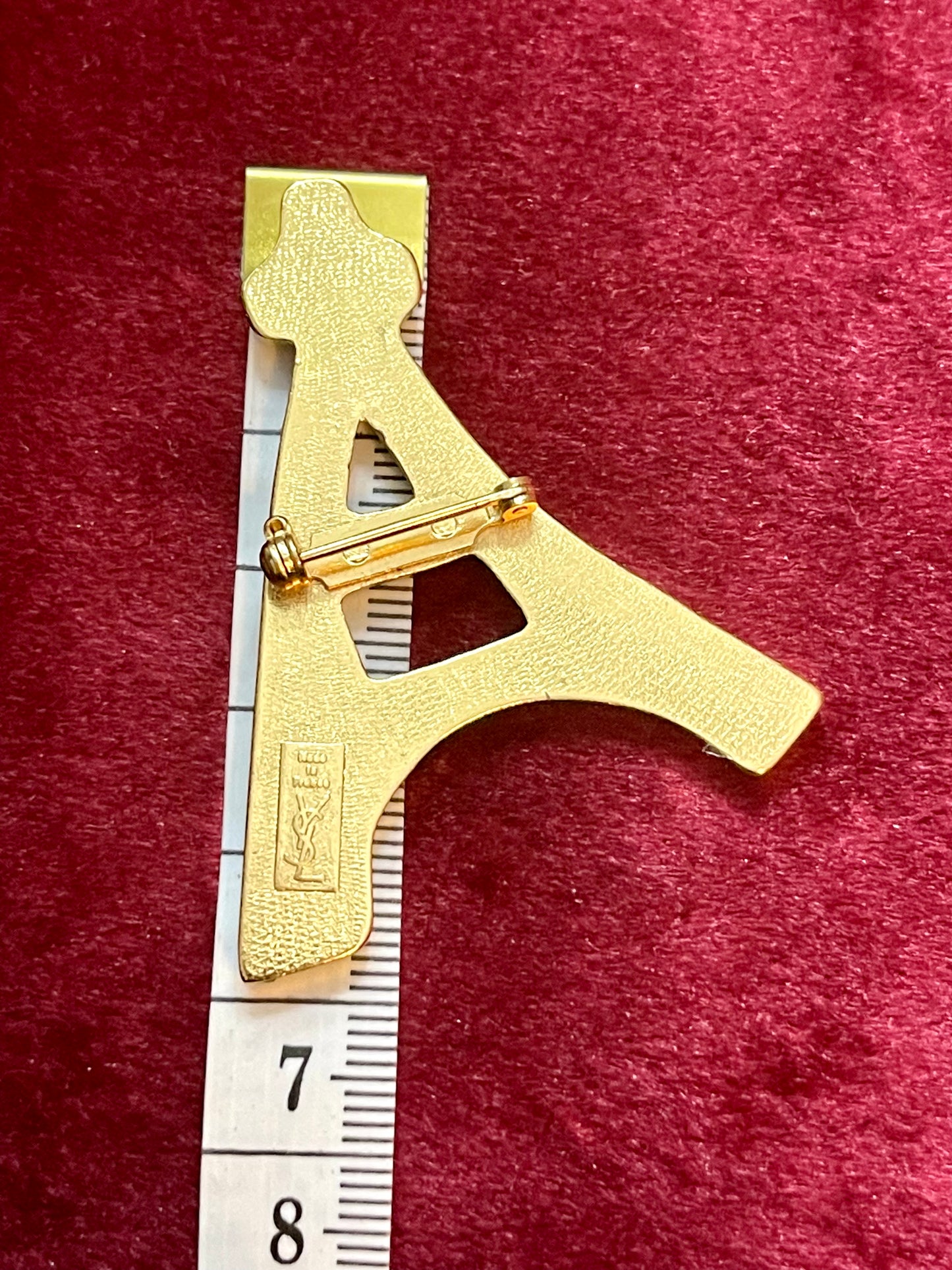 Length 6cm Arty Eiffel Tower vintage Yves Saint Laurent authentic brooch YSL signed using measuring tape showcasing