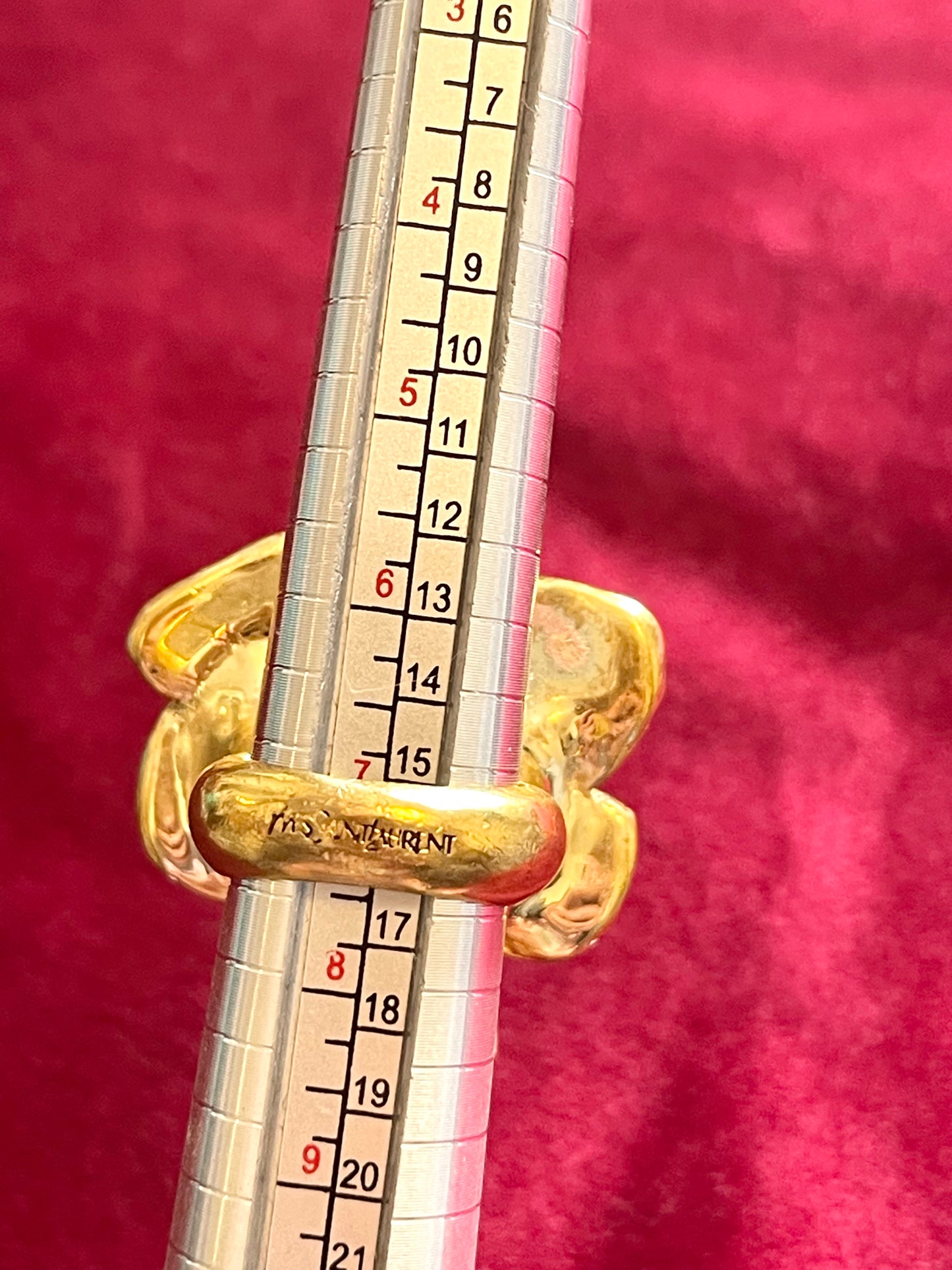 Size 8 Close-up of YSL gold-tone flower ring with rhinestones and pink enamel detail