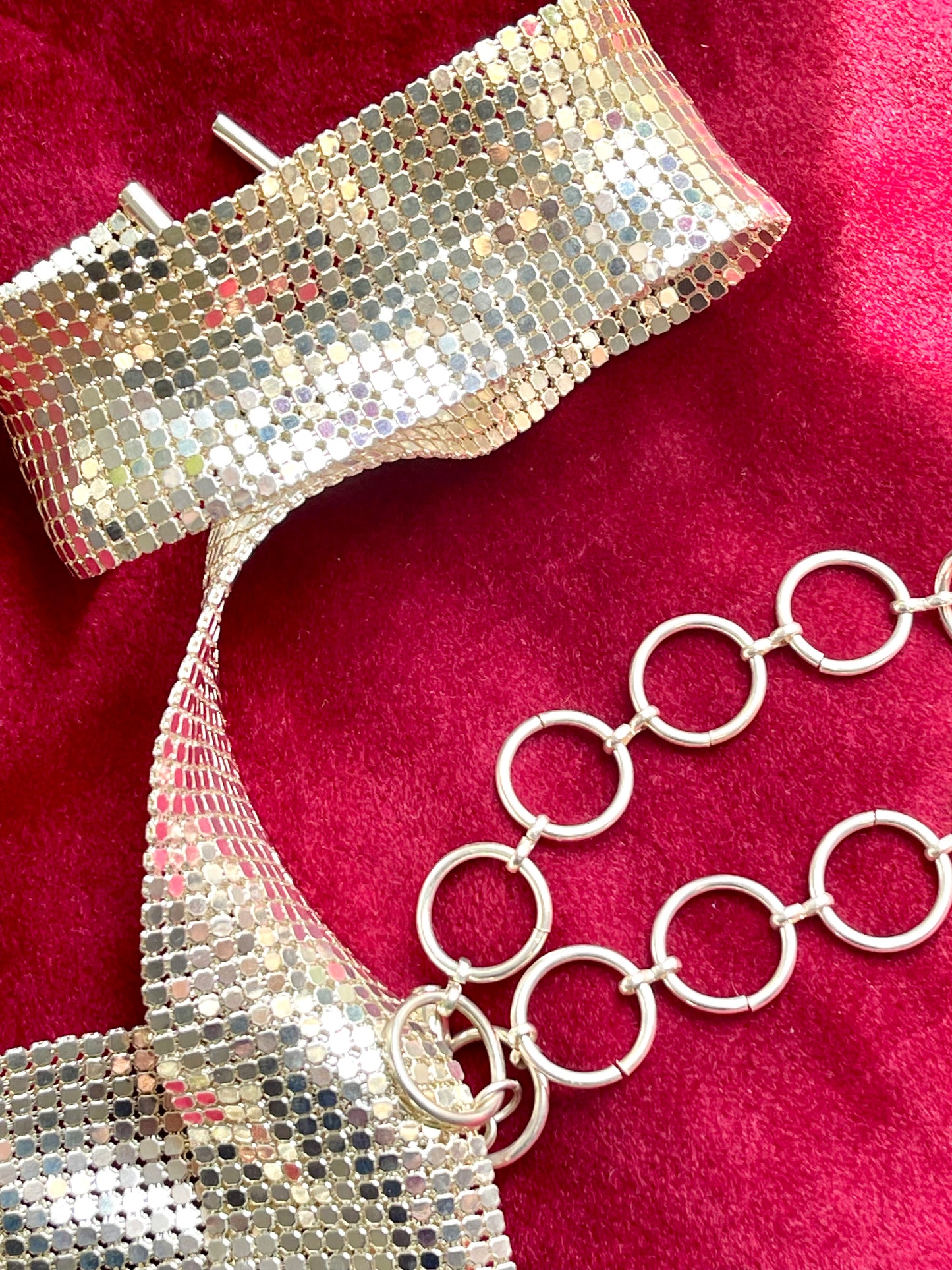Side view of adjustable hoop links and toggle clasp of Paco Rabanne vintage pixel belt