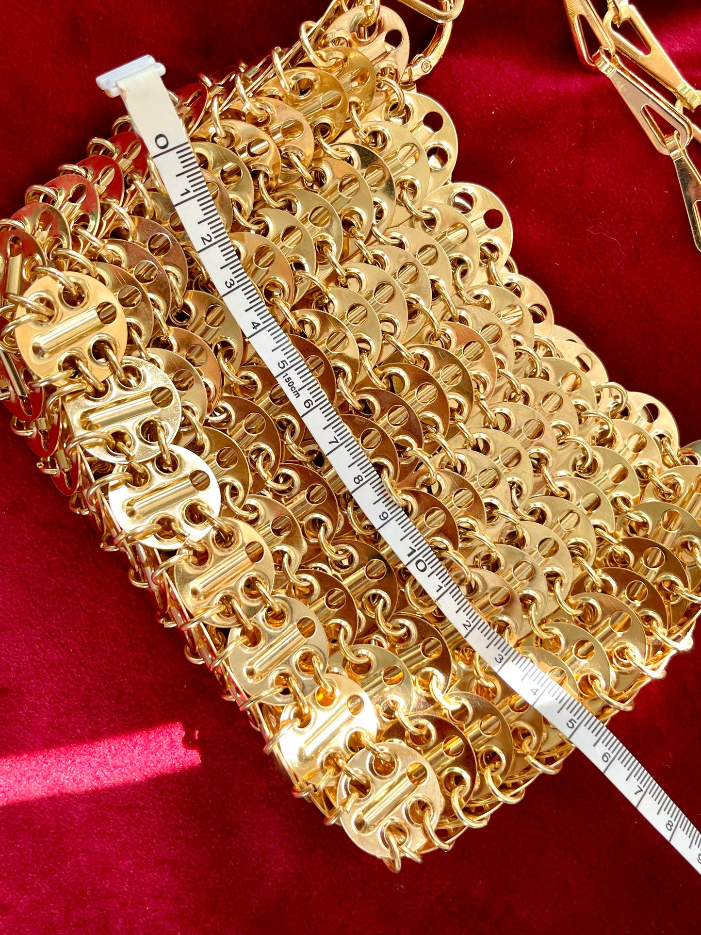 Using a measuring tape Rose gold sparkle 1969 design bag style Paco Rabanne