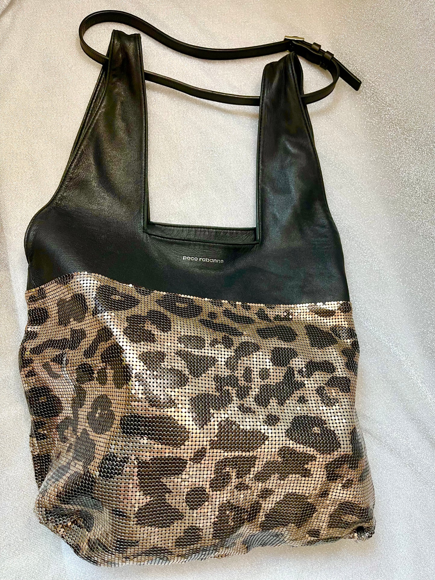 Close up Paco Rabanne leopard mesh leather bag held