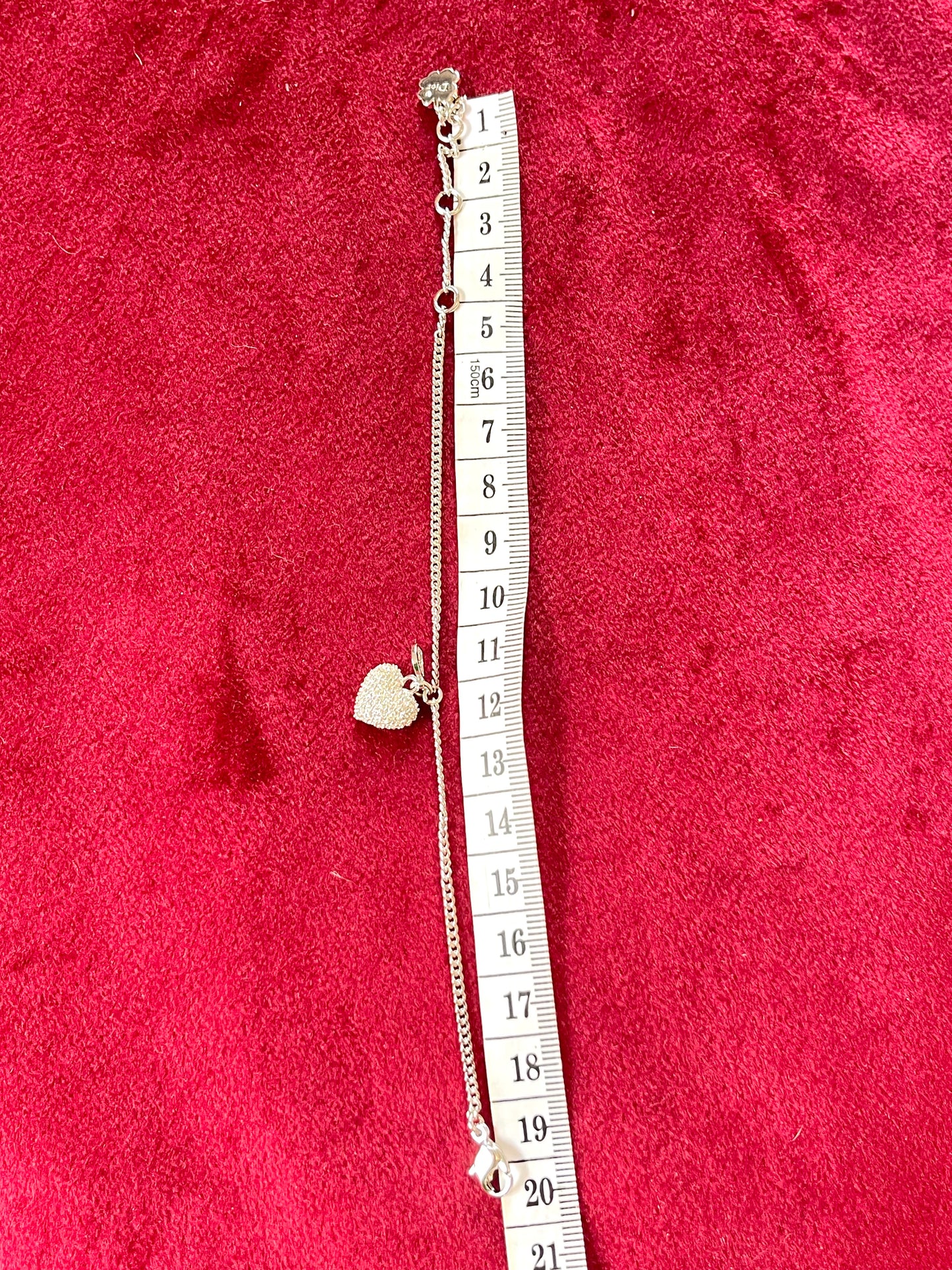 Pulsera auténtica vintage Dior con dije de corazón en tono plateado