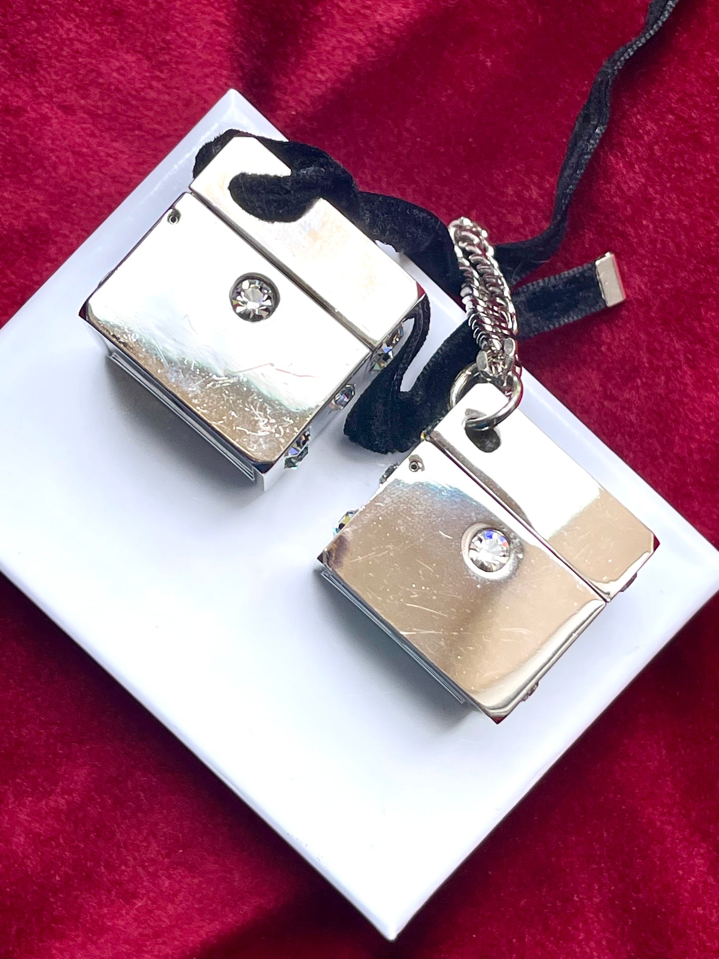 Close up Side view of vintage Dior Play dice-shaped bag charm with silver finish and embedded crystals vintage collection 2000