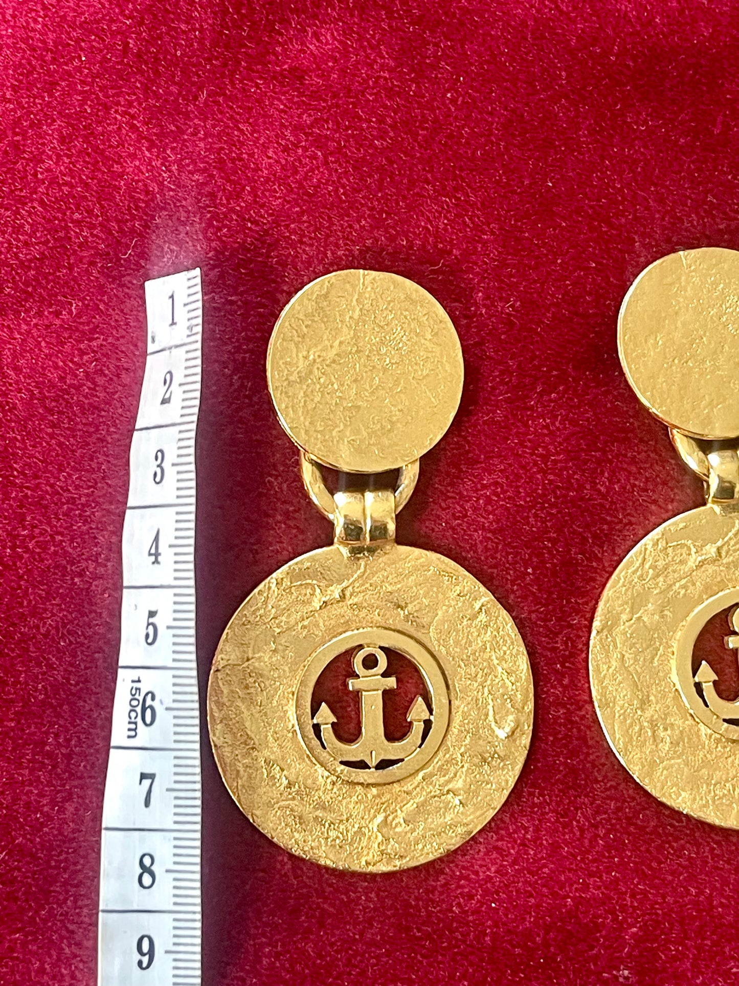 Long vintage YSL anchor earrings displayed with measuring tape showing 7.5 cm length.