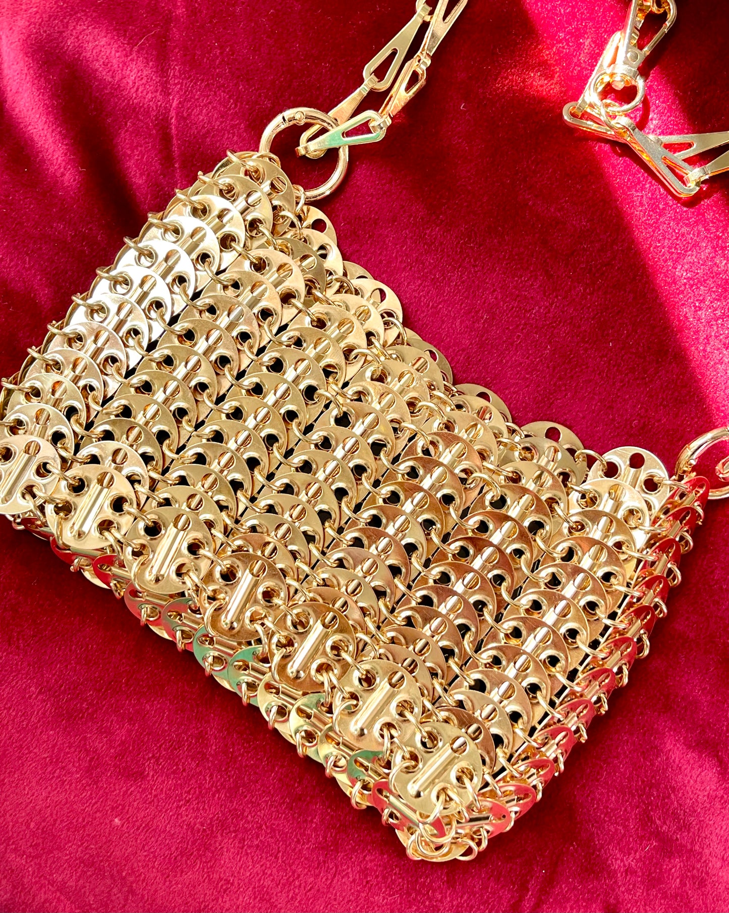 Close up view of Rose gold sparkle 1969 design bag style Paco Rabanne