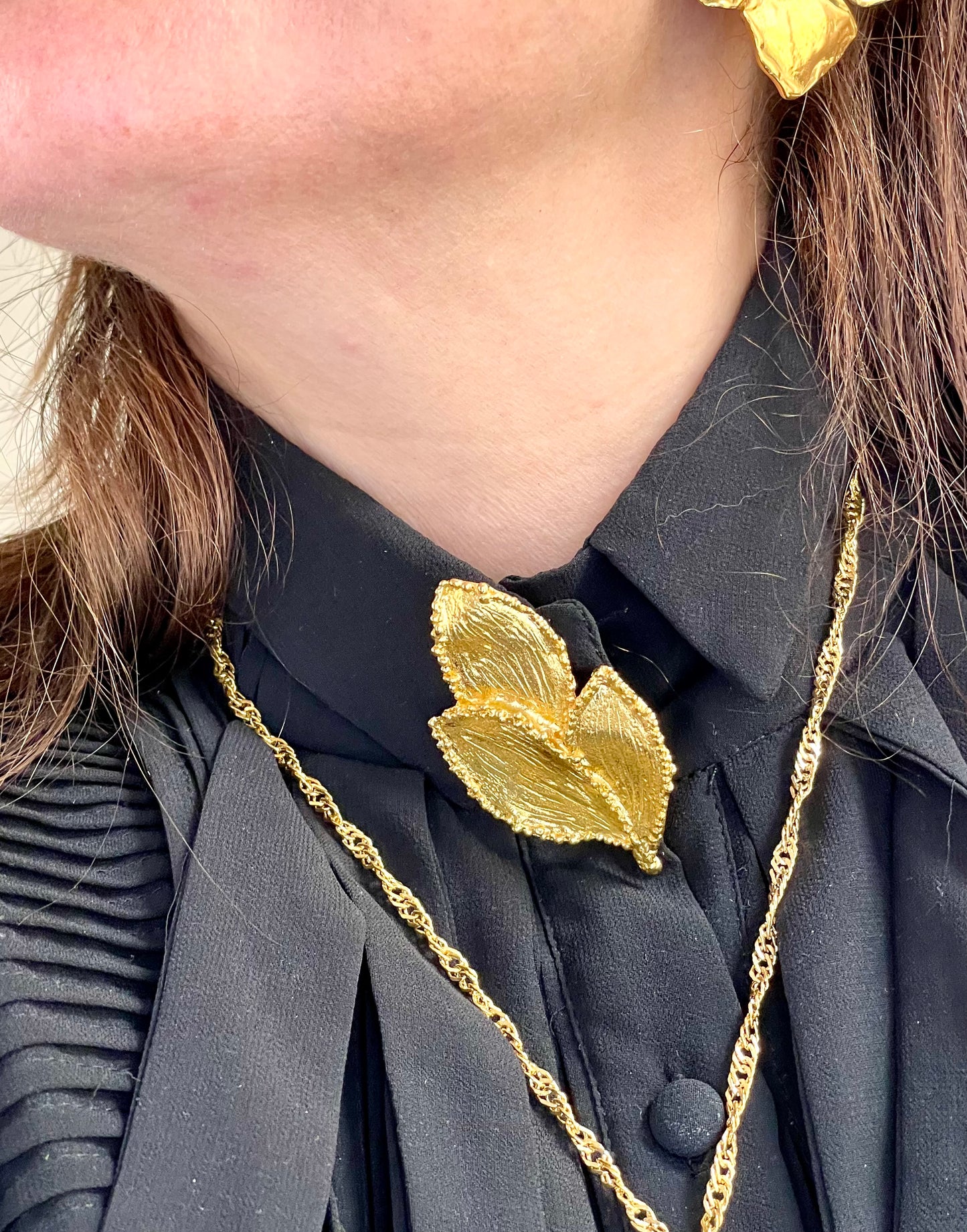 Close up worn by model Vintage Yves Saint Laurent 80s 90s gold tone leaf brooch excellent condition designer jewelry