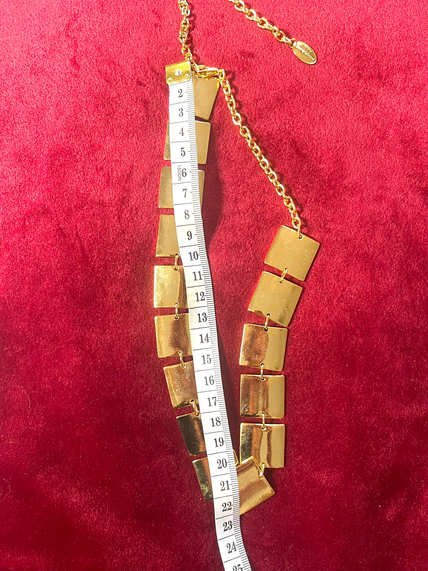 Dimensions of necklace Close up of Iconic Paco Rabanne vintage gold plated jewelry set , bracelet- necklace refurbished 18KG using a measuring tape