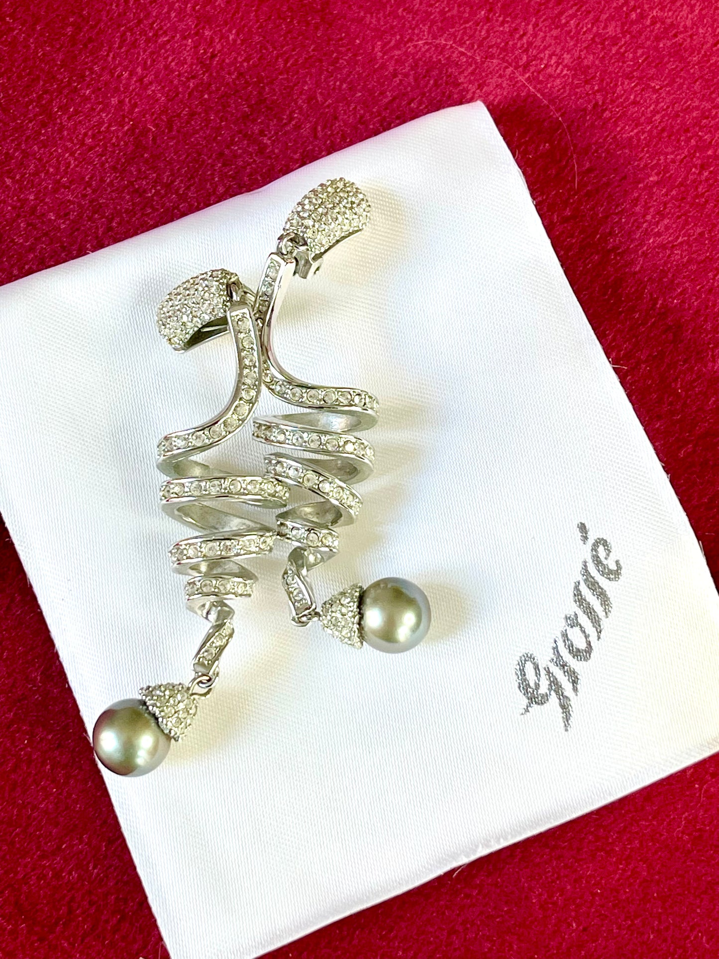 Grossé silver-tone drop earrings with rhinestones and grey pearl, displayed on branded box