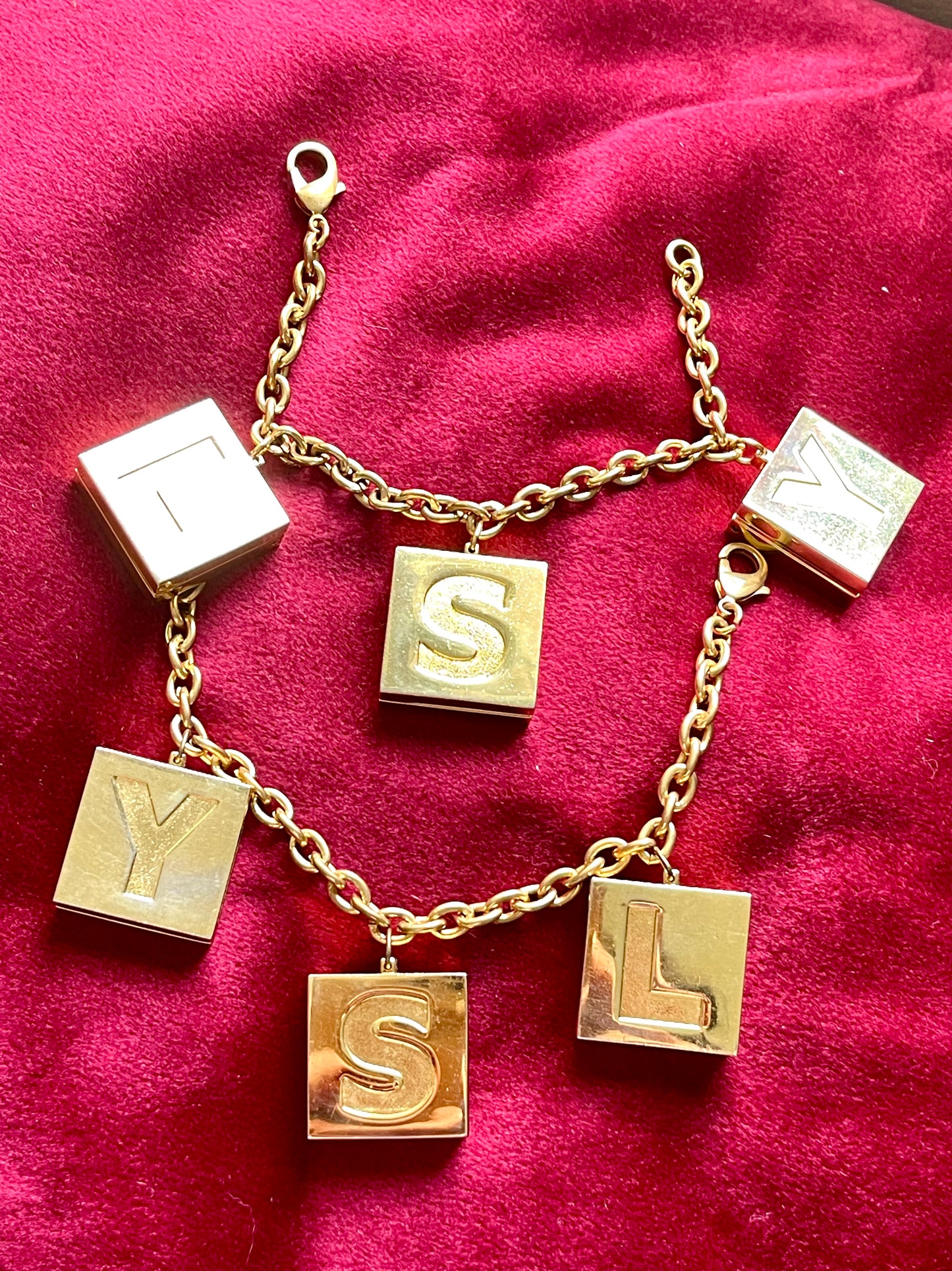 YSL Yves Saint Laurent vintage 2000 makeup bracelet very good condition on red velvet background