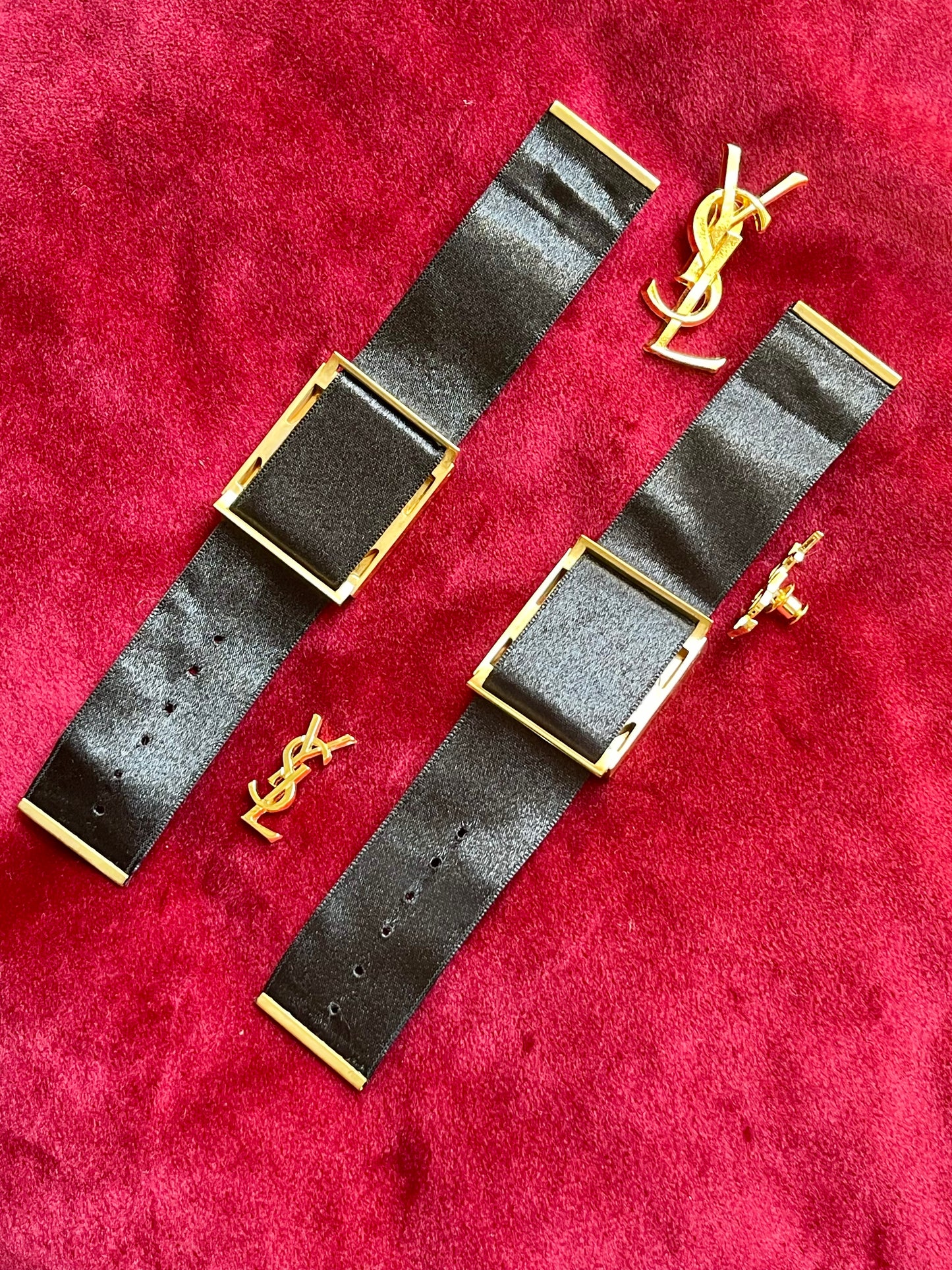 Back view Fashion Bracelet makeup Yves Saint Laurent vintage 2000 displayed with YSL pins on a red velvet background