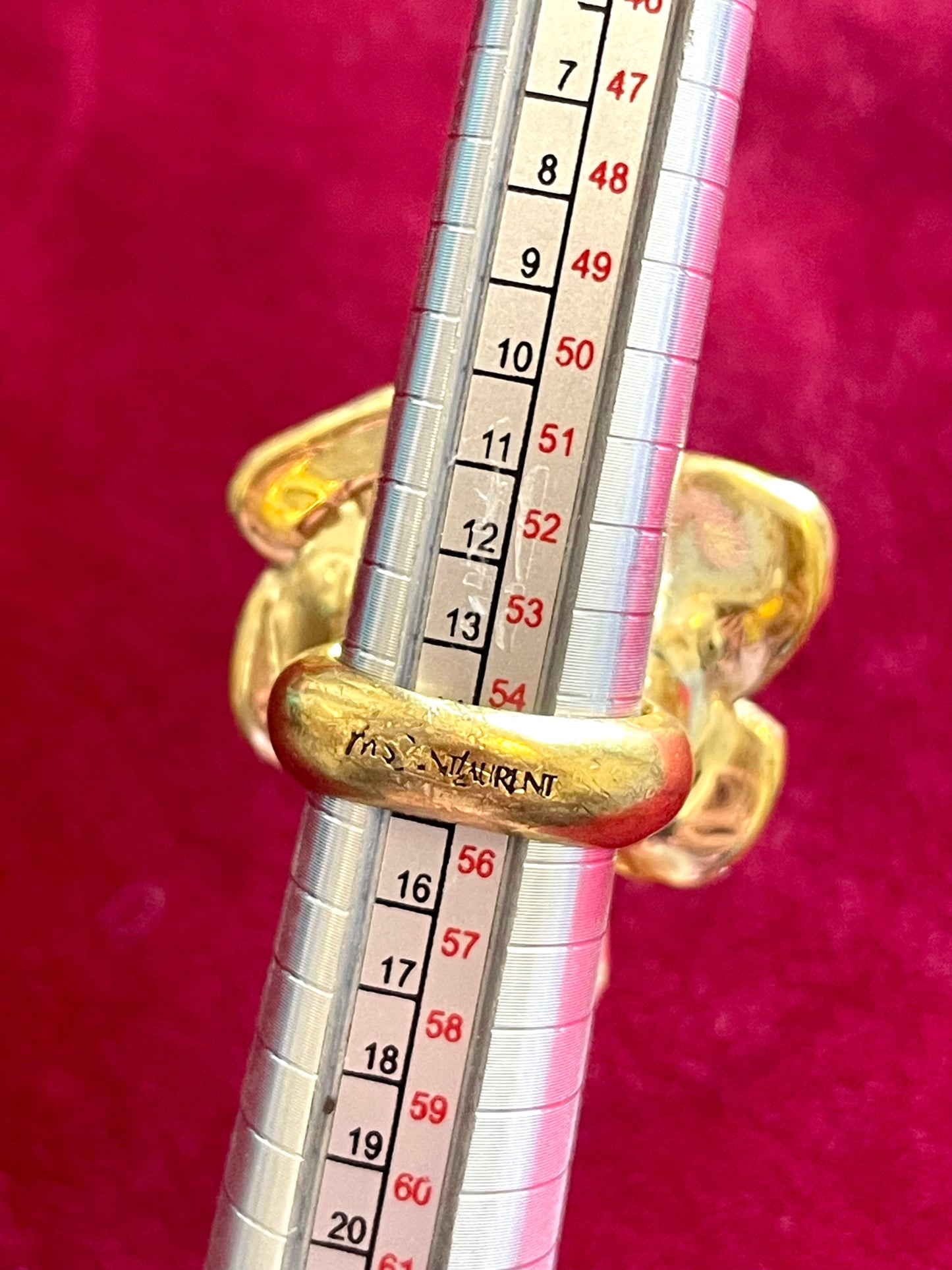 Size measurements Close-up of YSL gold-tone flower ring with rhinestones and pink enamel detail