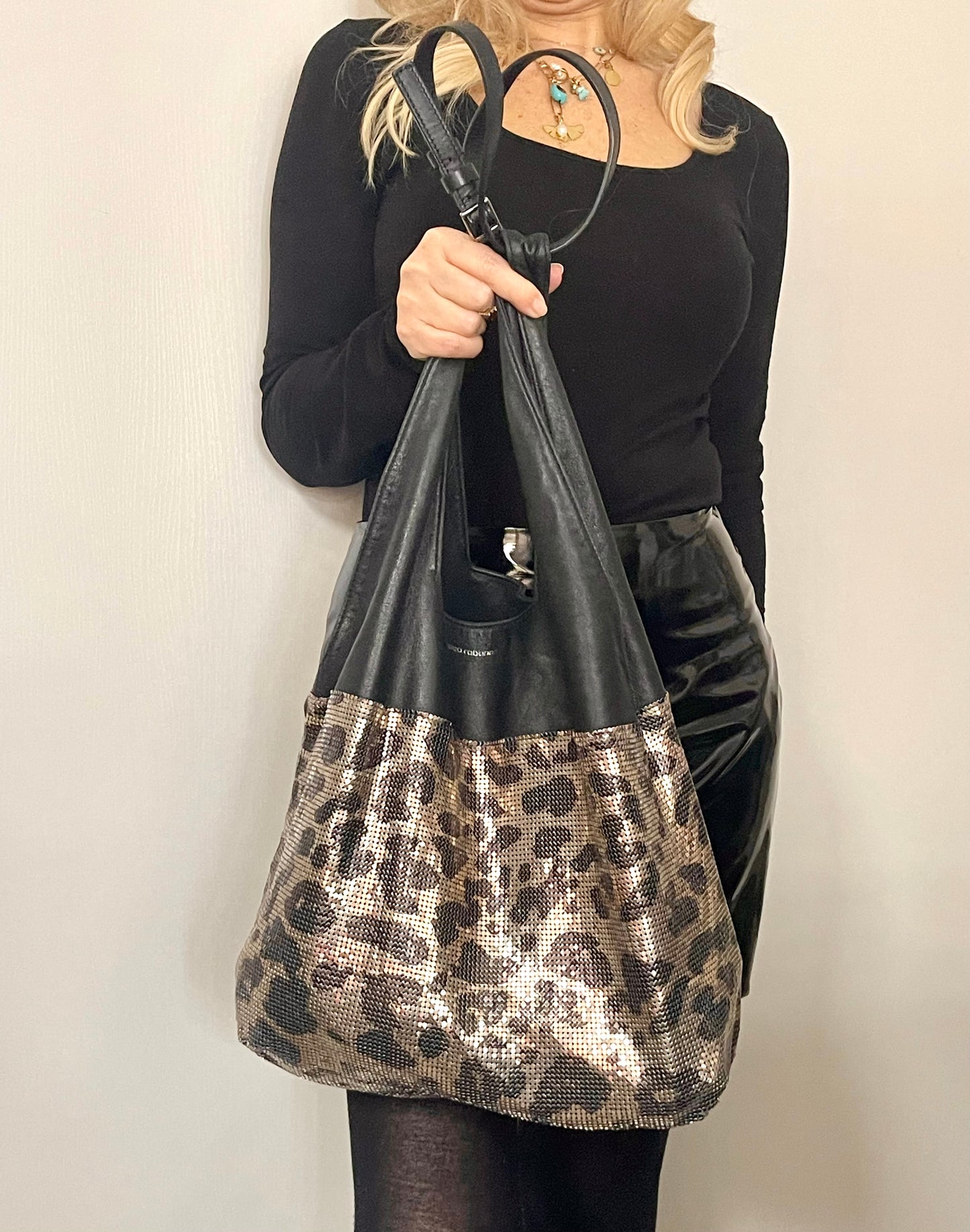 Paco Rabanne leopard mesh leather bag held by model
