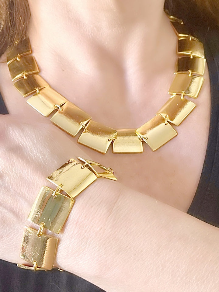 Over view of Iconic Paco Rabanne vintage gold plated jewelry set , bracelet- necklace refurbished 18KG worn on model