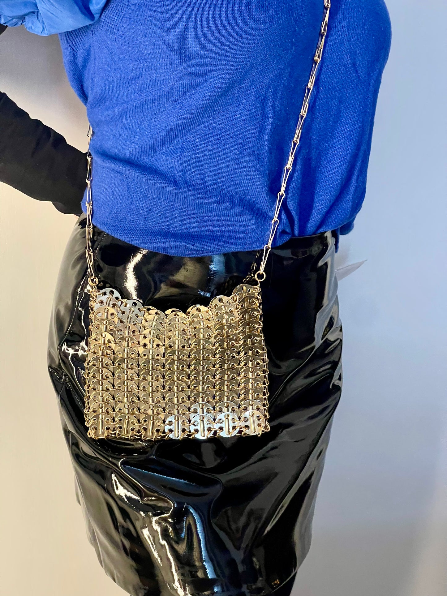 Worn by model gold sparkle 1969 design bag style Paco Rabanne