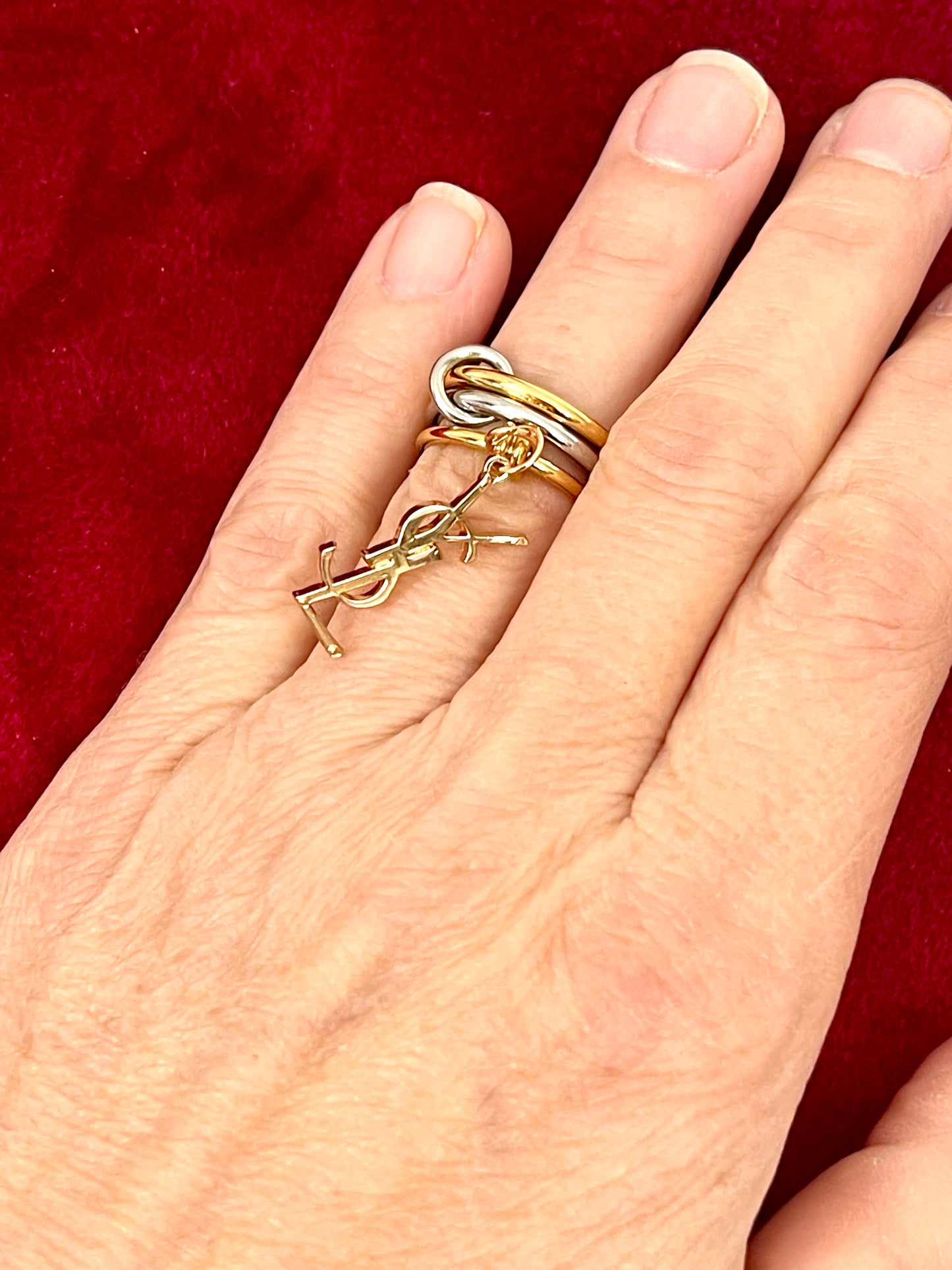 Worn as a ring Yves Saint Laurent authentic charm as a ring pendant and bracelet with magnetic black cord
