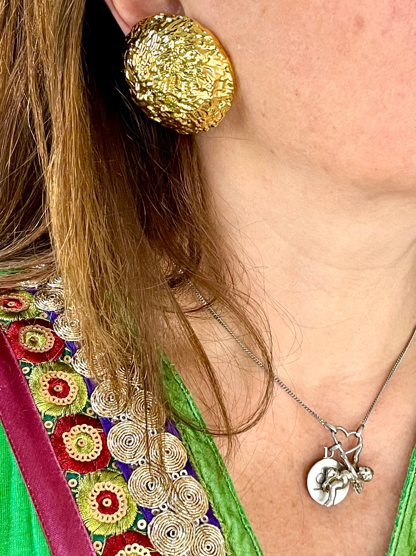 Worn by a model Vintage 80’s clip on earrings, repurposed with 18KG classic designer collectibles