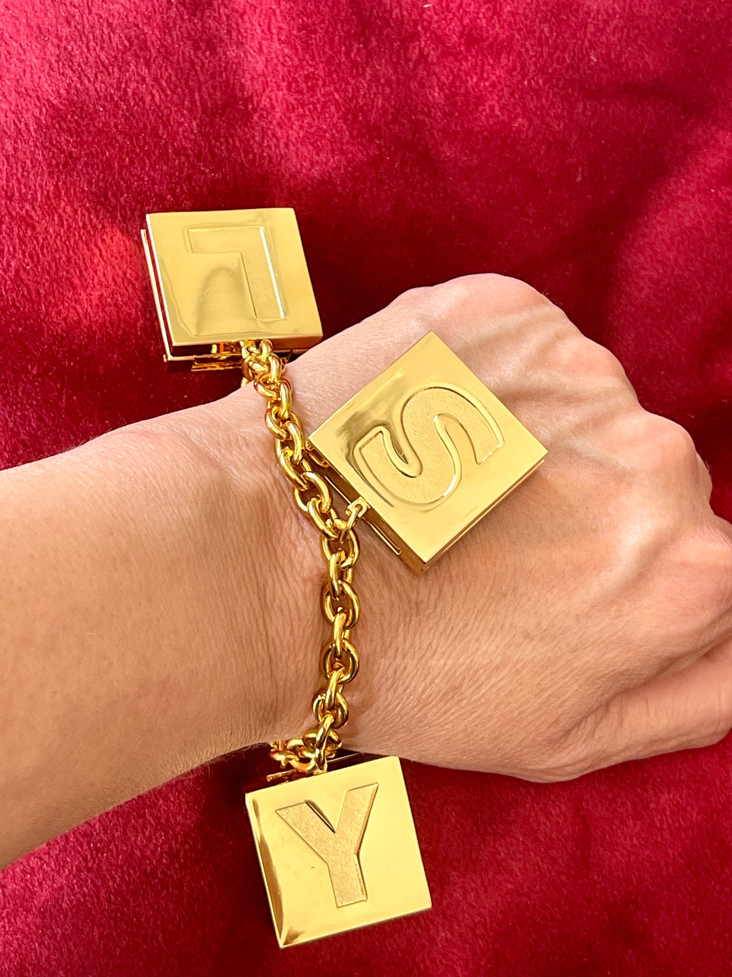 YSL Yves Saint Laurent vintage 2000 makeup bracelet very good condition on red velvet background on hand