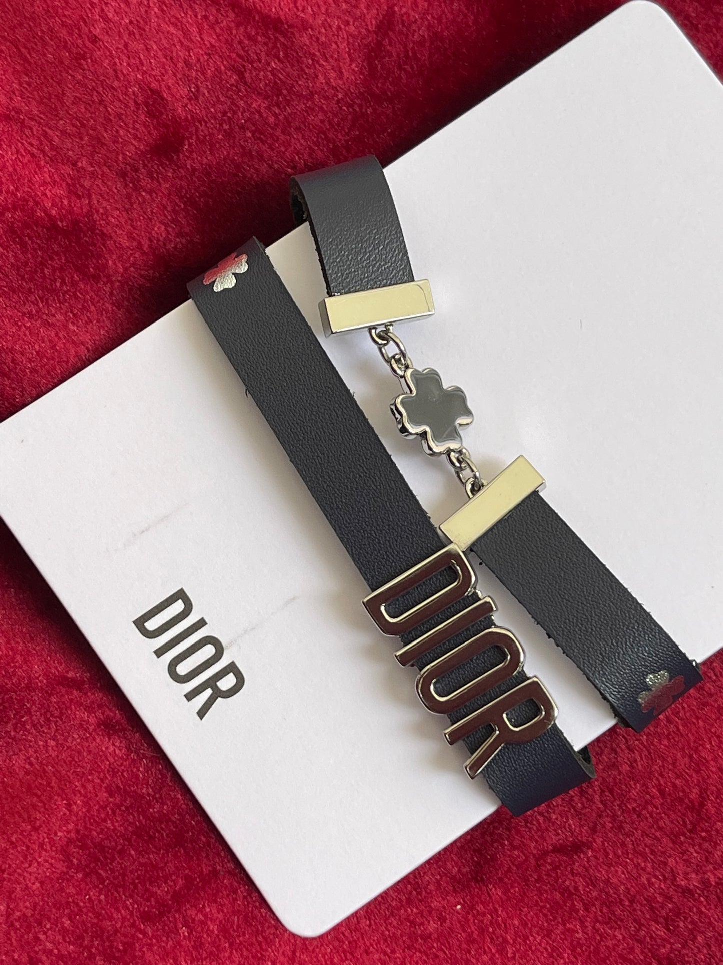 iconic house of Dior , Silver clover charm bracelet , Dior black leather bracelet , Vintage Dior strap , Dior beauty , new collectible bracelet charms designer accessories ready - to - wear