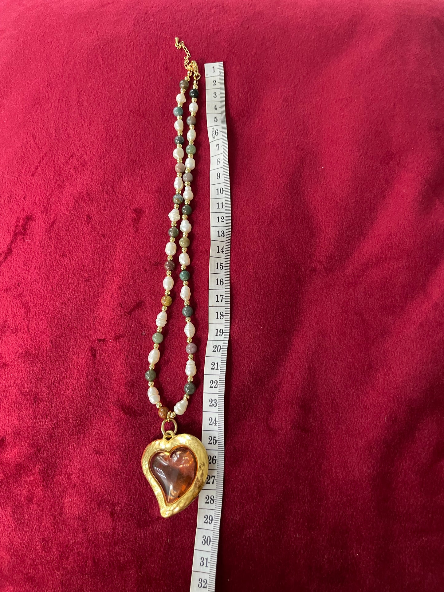 Using a measuring tape, Vintage Yves Saint Laurent Flower petal pendant with a fresh water pearl and precious stones necklace, 