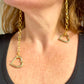 Dangling gold-plated YSL earrings, elegant asymmetrical design Worn by model 
