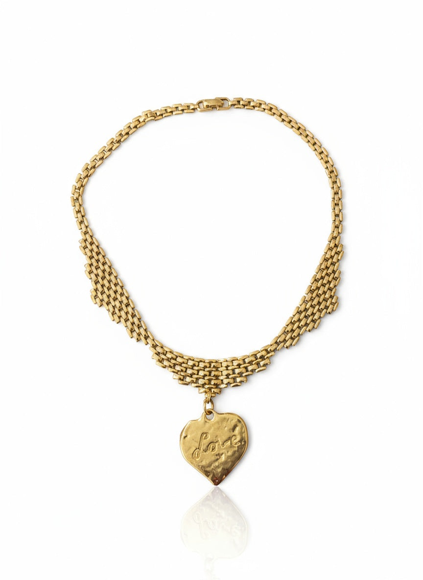 Vintage Refurbished 18KG Yves Saint Laurent 80s pendant Monet gold necklace displayed on white background 