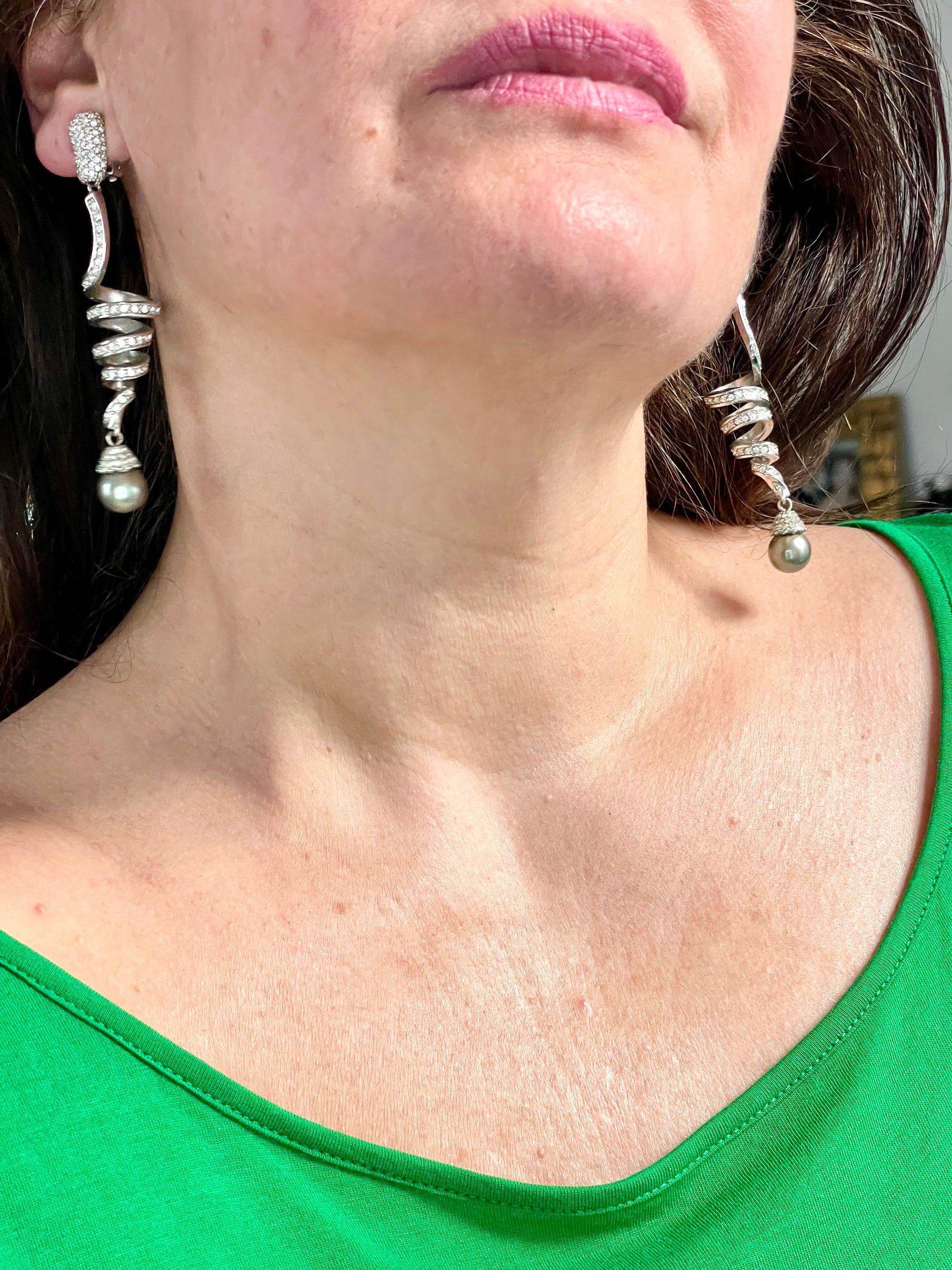 Grossé Dior earrings worn, showcasing elegant drop design and pearl detail