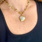 Vintage Yves Saint Laurent heart rhinestone pendant necklace with gold stainless steel chain worn by model
