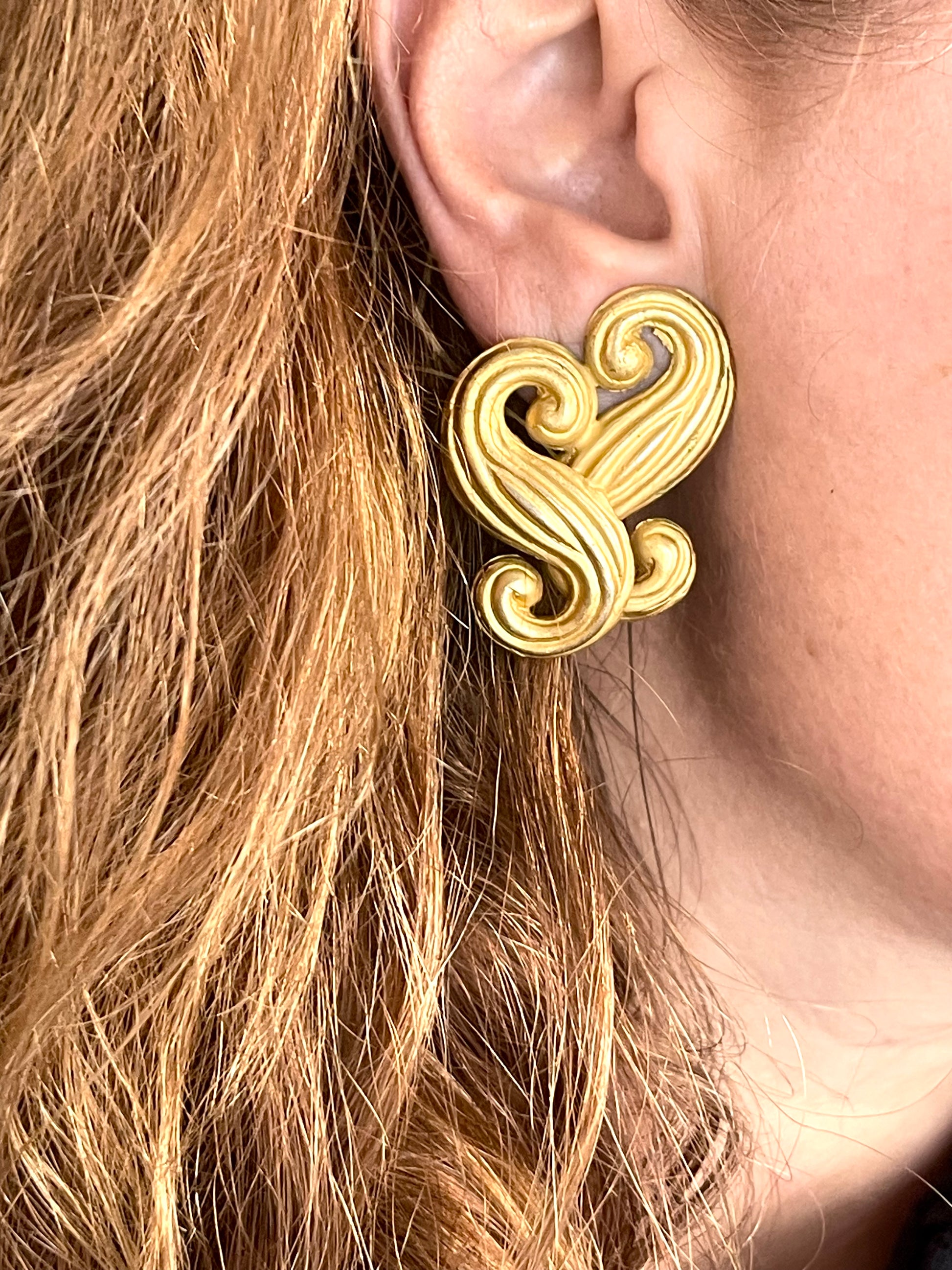 Vintage Nina Ricci statement heart earrings shown worn for scale