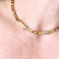 Vintage Christian Dior two-tone necklace worn around the neck, showcasing its elegant designer style from each side very good condition 