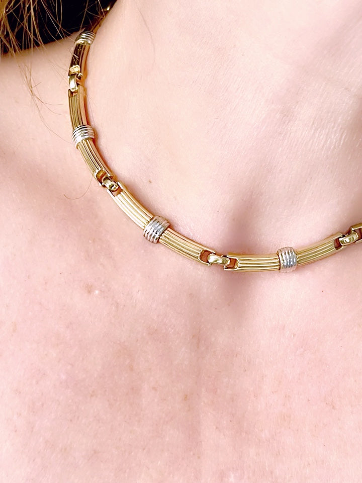 Vintage Christian Dior two-tone necklace worn around the neck, showcasing its elegant designer style from each side very good condition 