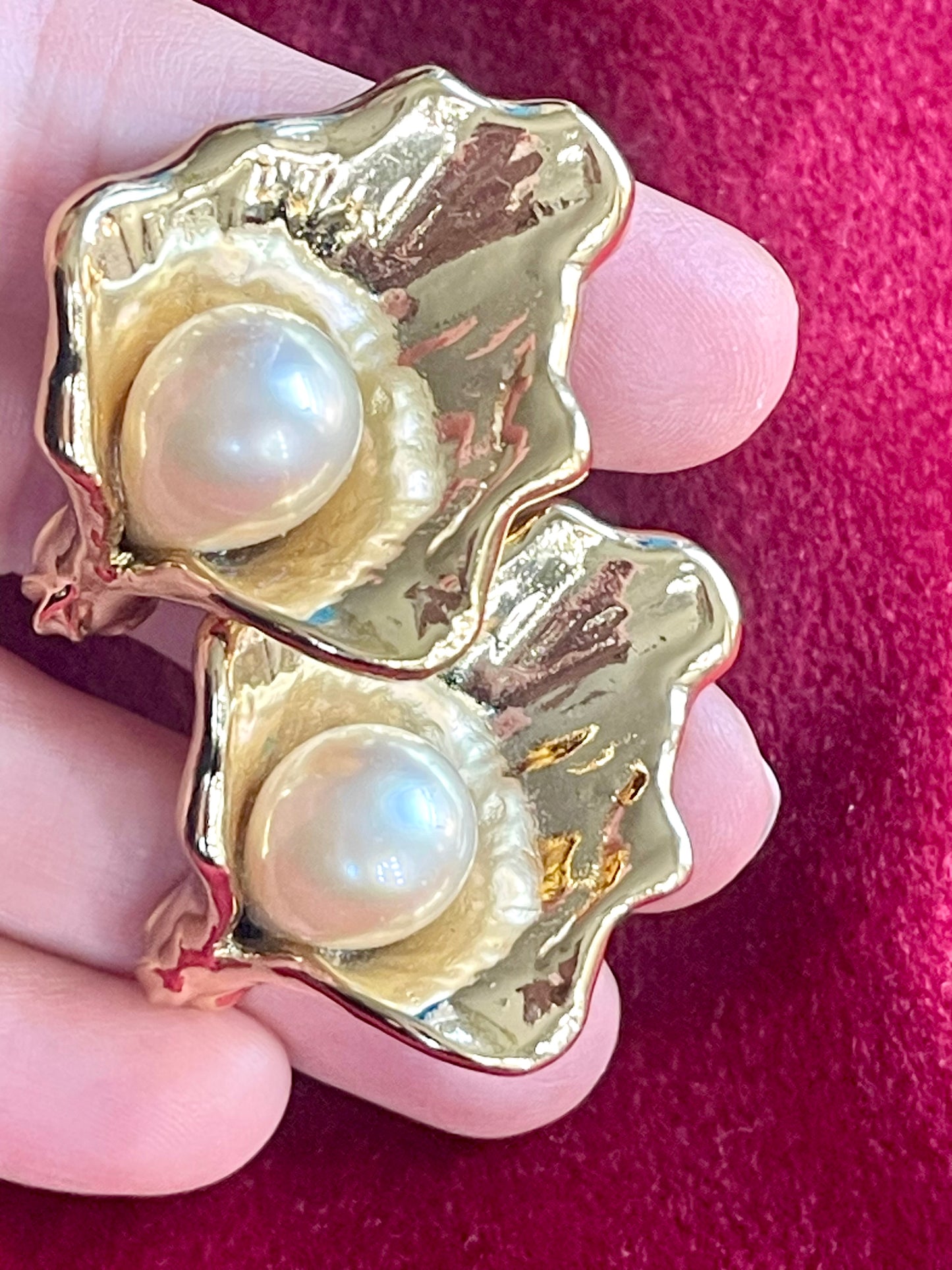 Close up on Authentic vintage Yves Saint Laurent earrings, organic gold-tone flower design with pearl accents