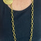 Collar de acero con porta bufandas vintage de Yves Saint Laurent: auténtica joyería reutilizada