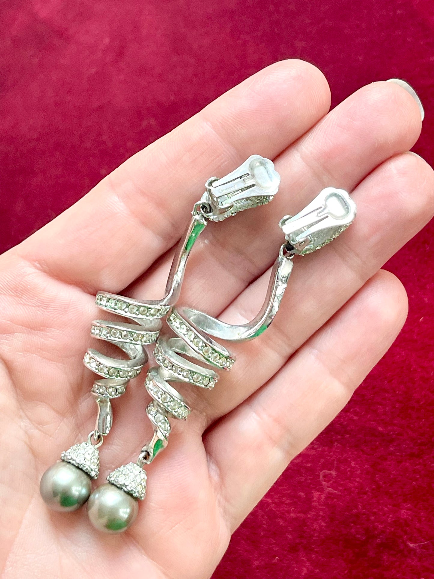 Back of Grossé Dior earring showing clip-on fastening in silver-tone metal.