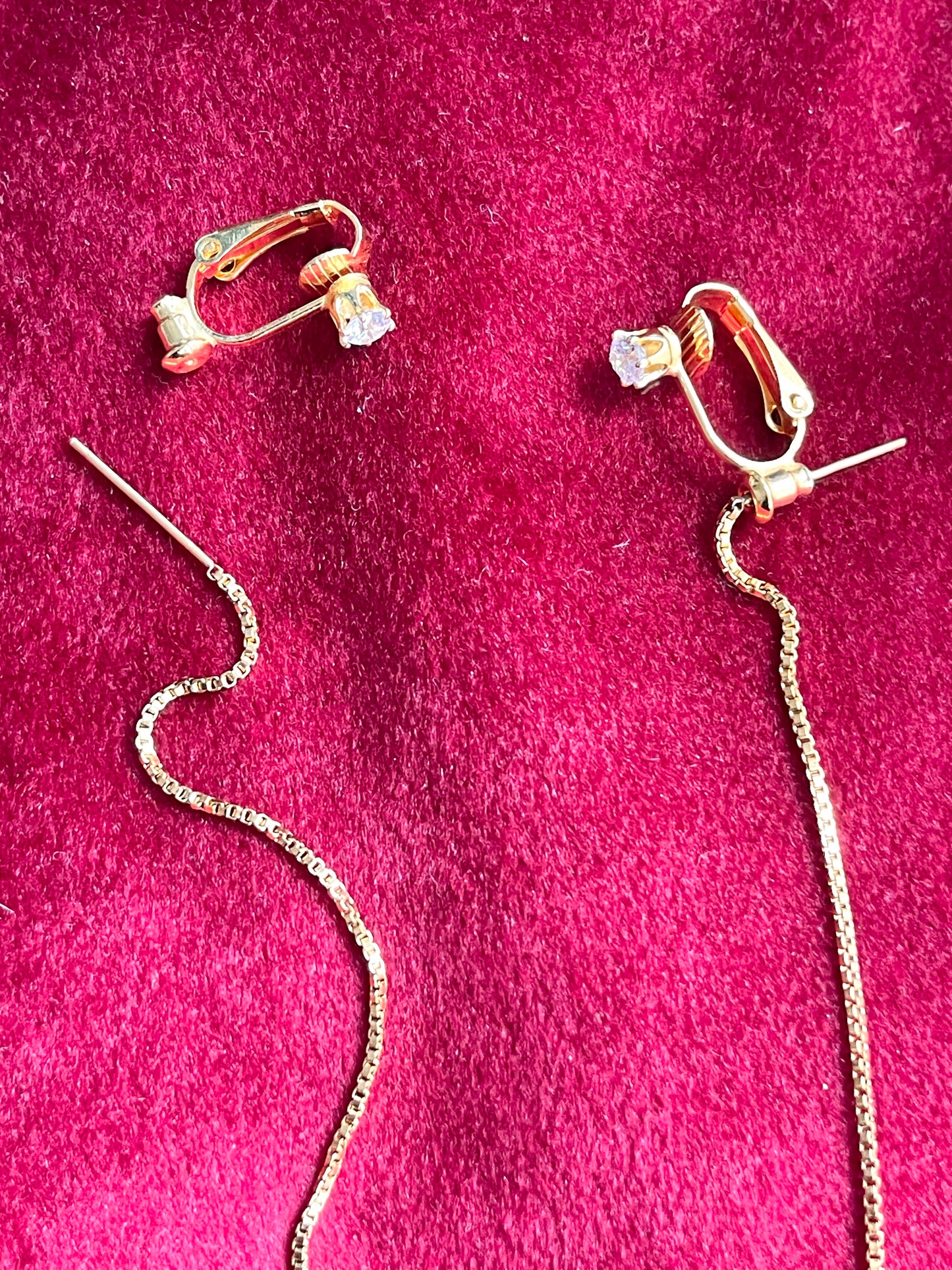 Close up on string and clip-on YSL snowflake pendant earrings 