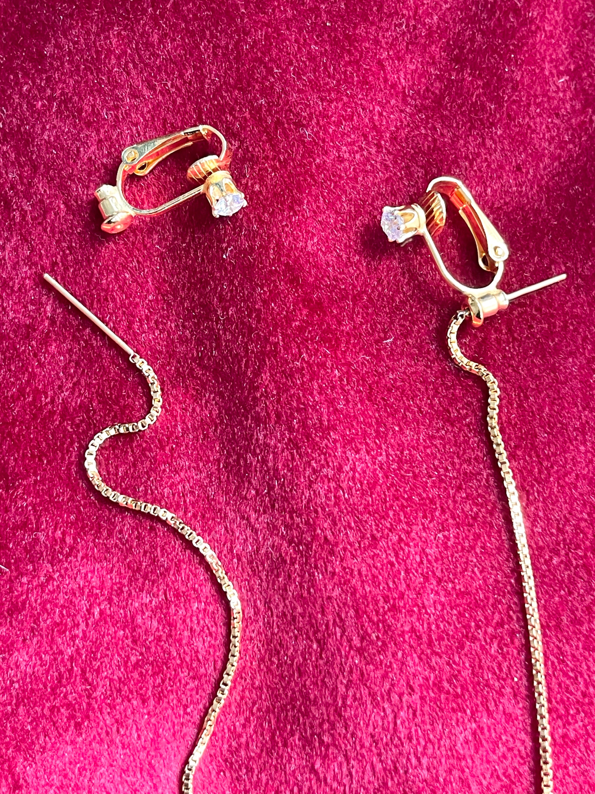 Close up on string and clip-on YSL snowflake pendant earrings 