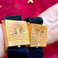 Worn by model two Fashion Bracelet makeup Yves Saint Laurent vintage 2000 displayed with YSL pins on a red velvet background 