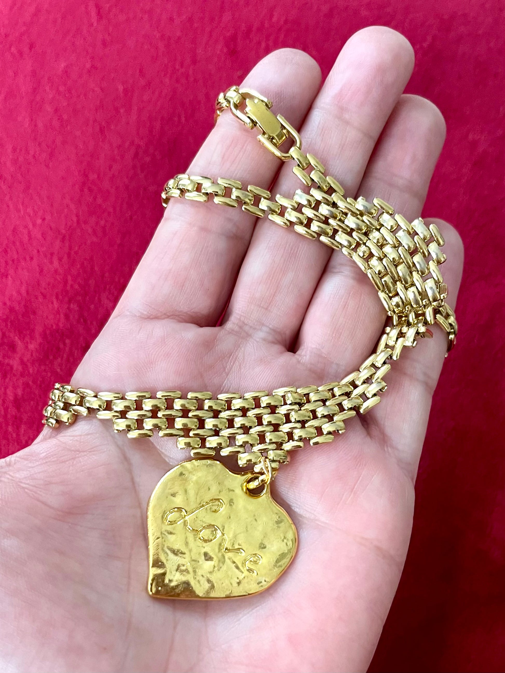 Displayed on hand Vintage Refurbished 18KG Yves Saint Laurent 80s love pendant Monet gold necklace 