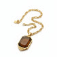 Golden Dior couture vintage pendant necklace with amber gem and Dior engraving on 