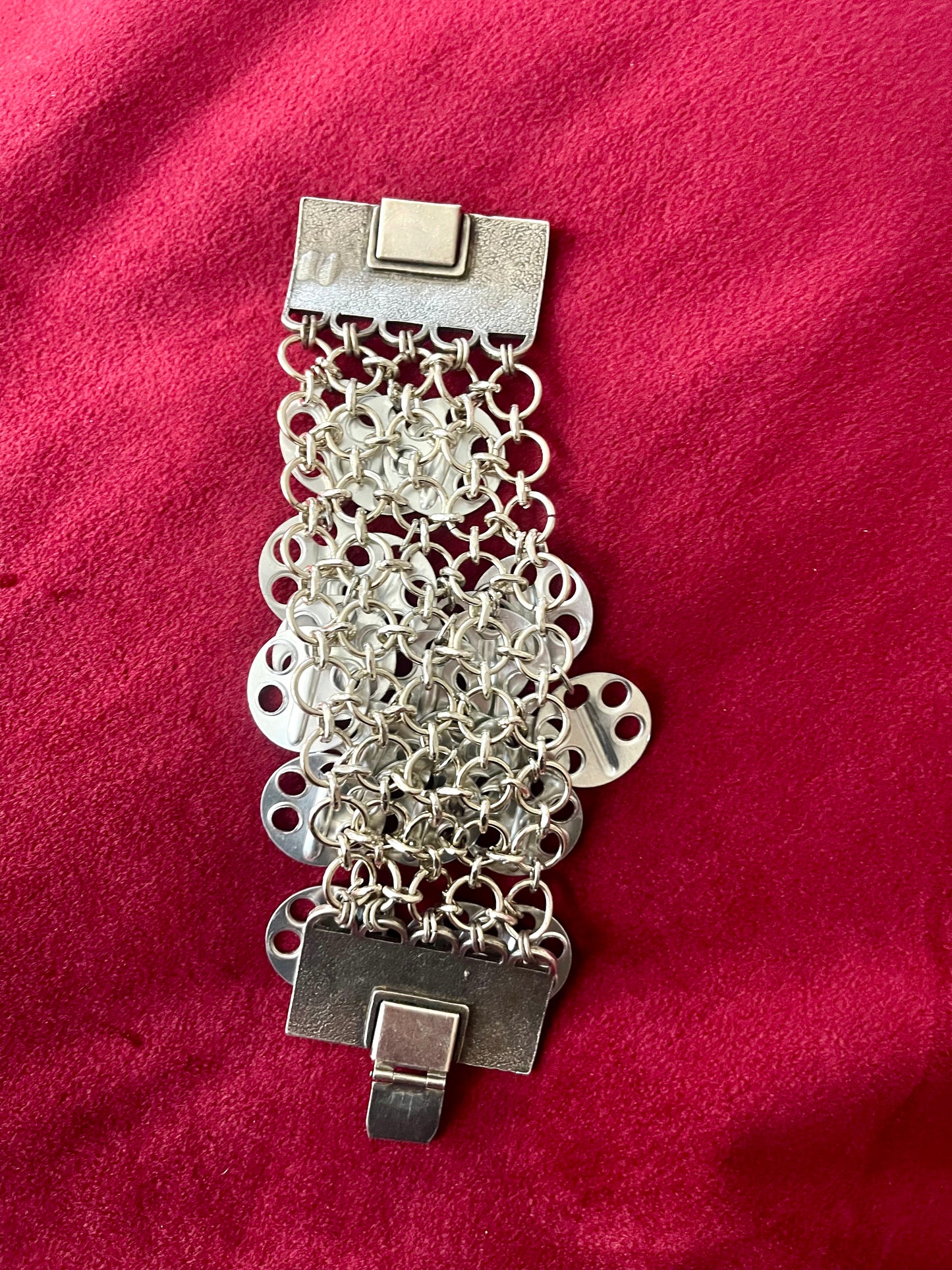 Paco Rabanne silver-tone statement bracelet details Back view on a red background 