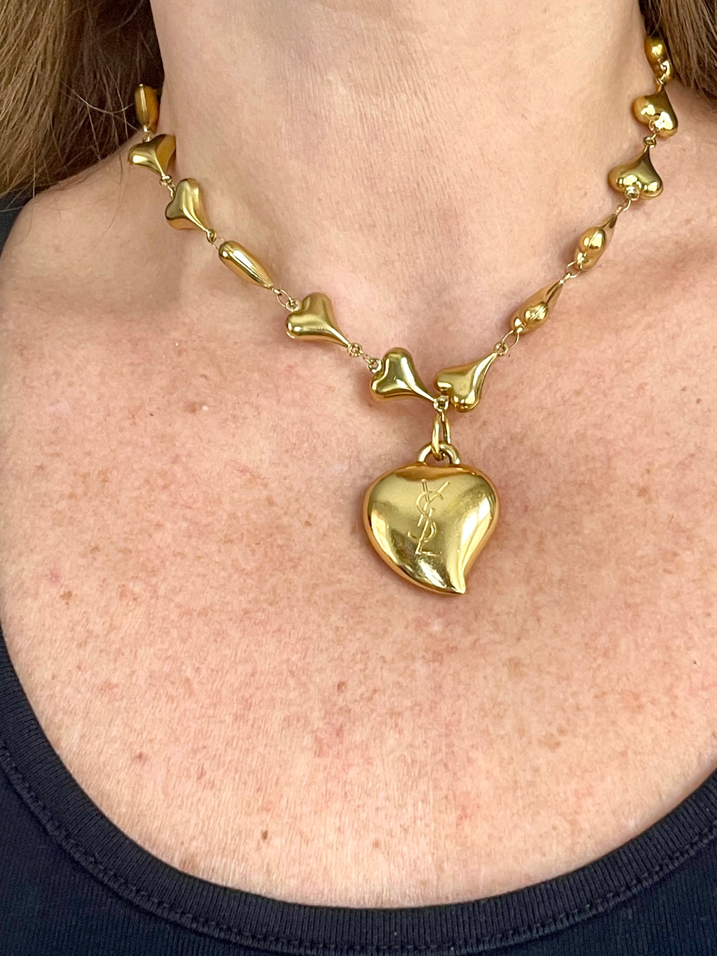 Back view Vintage YSL rhinestone heart pendant necklace worn by model showing size and gold chain detail, Valentine's Day gift