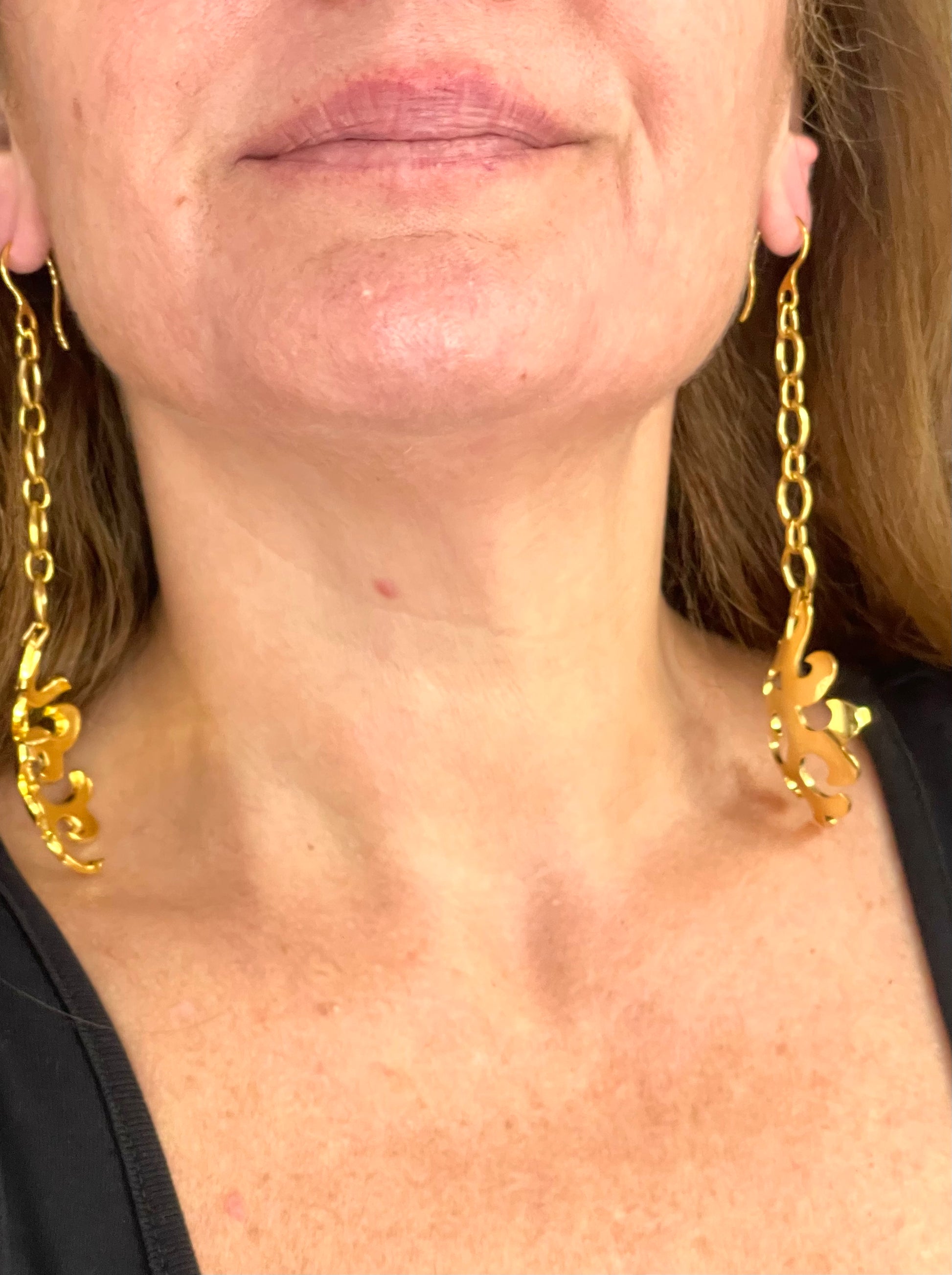 Yves Saint Laurent statement earrings worn showing elegant drop length