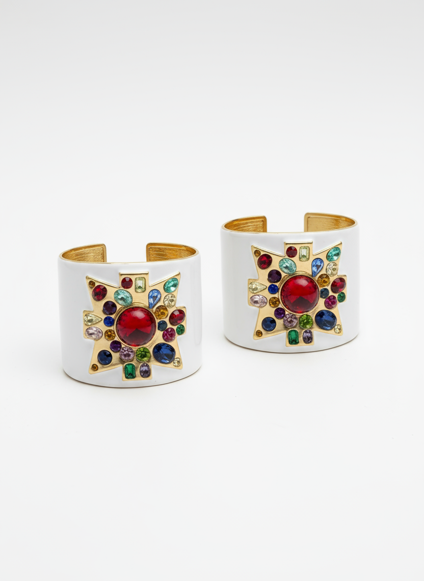 Two ornate cuff bracelets with colorful gemstones on a white background