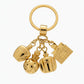 Christian Dior vintage Gold keychain with multiple charms Dolce Vita on a white background 