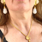 Worn by model a close up on Vintage Arty Yves Saint Laurent gilded necklace. Gold plated 18KG with Vintage YSL earrings 
