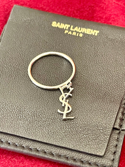 Front view of refurbished Yves Saint Laurent Mono ring with polished 18K white gold plating