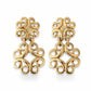 Front view of vintage gold-tone Yves Saint Laurent statement drop earrings displayed on A white background 
