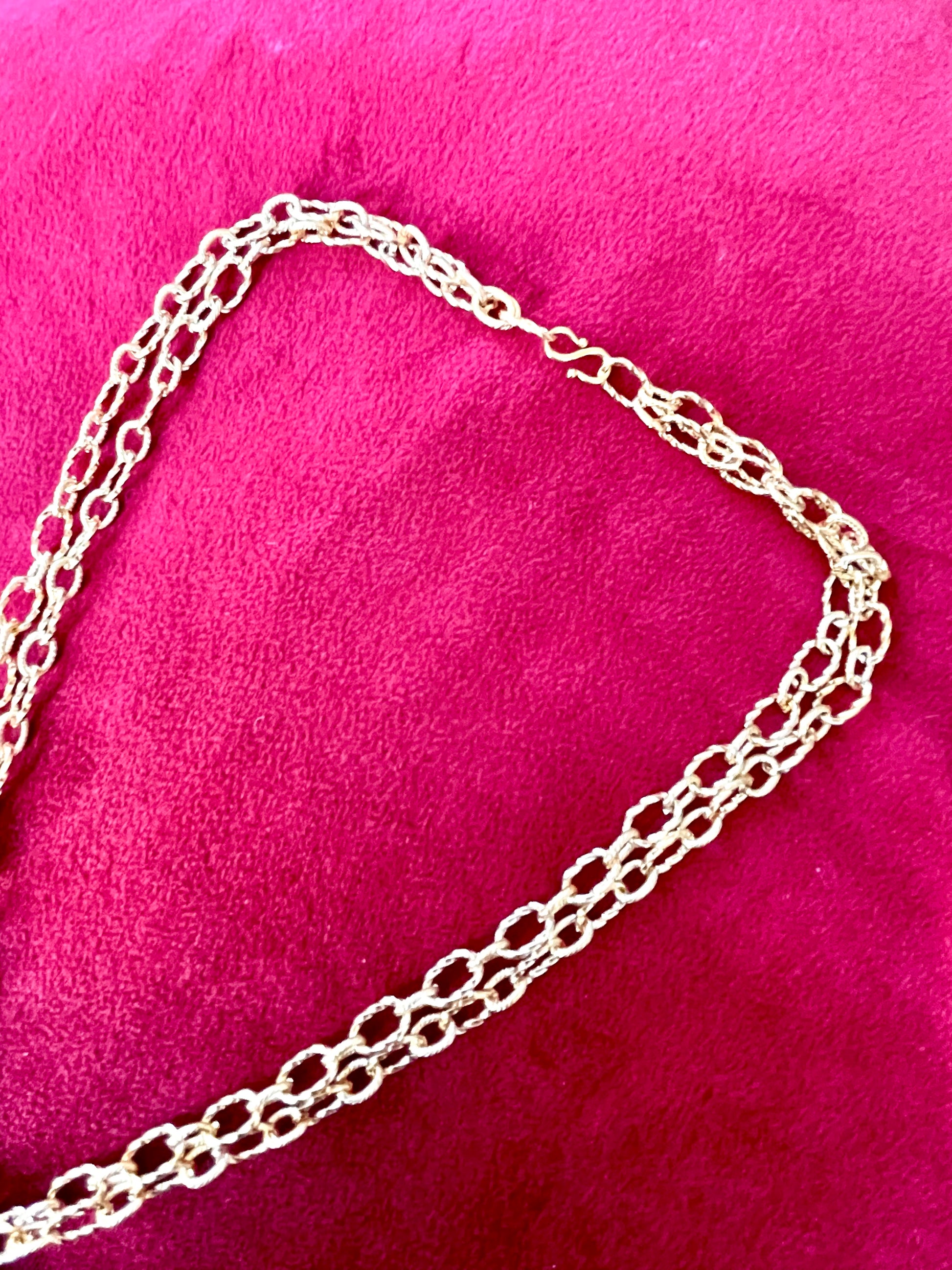 Adjustable clasp for long short stainless steel necklace with Yves Saint Laurent gold plated pendant , excellent condition 