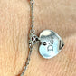 Close up on pendant charm of Vintage Dior silver tone rose beads chain bracelet with D charm signed 