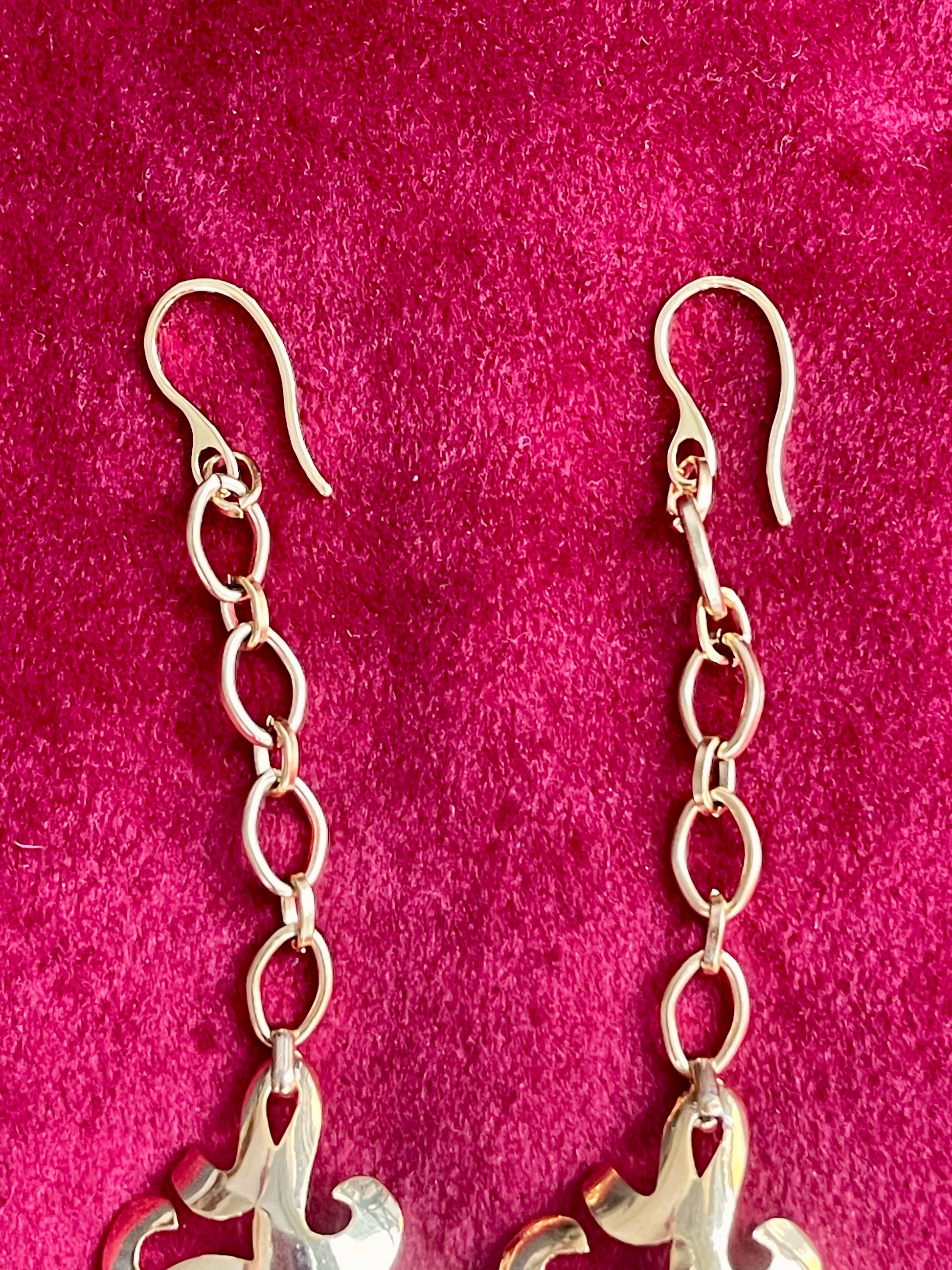 Detail of gold plated steel hook on Yves Saint Laurent upcycled earrings