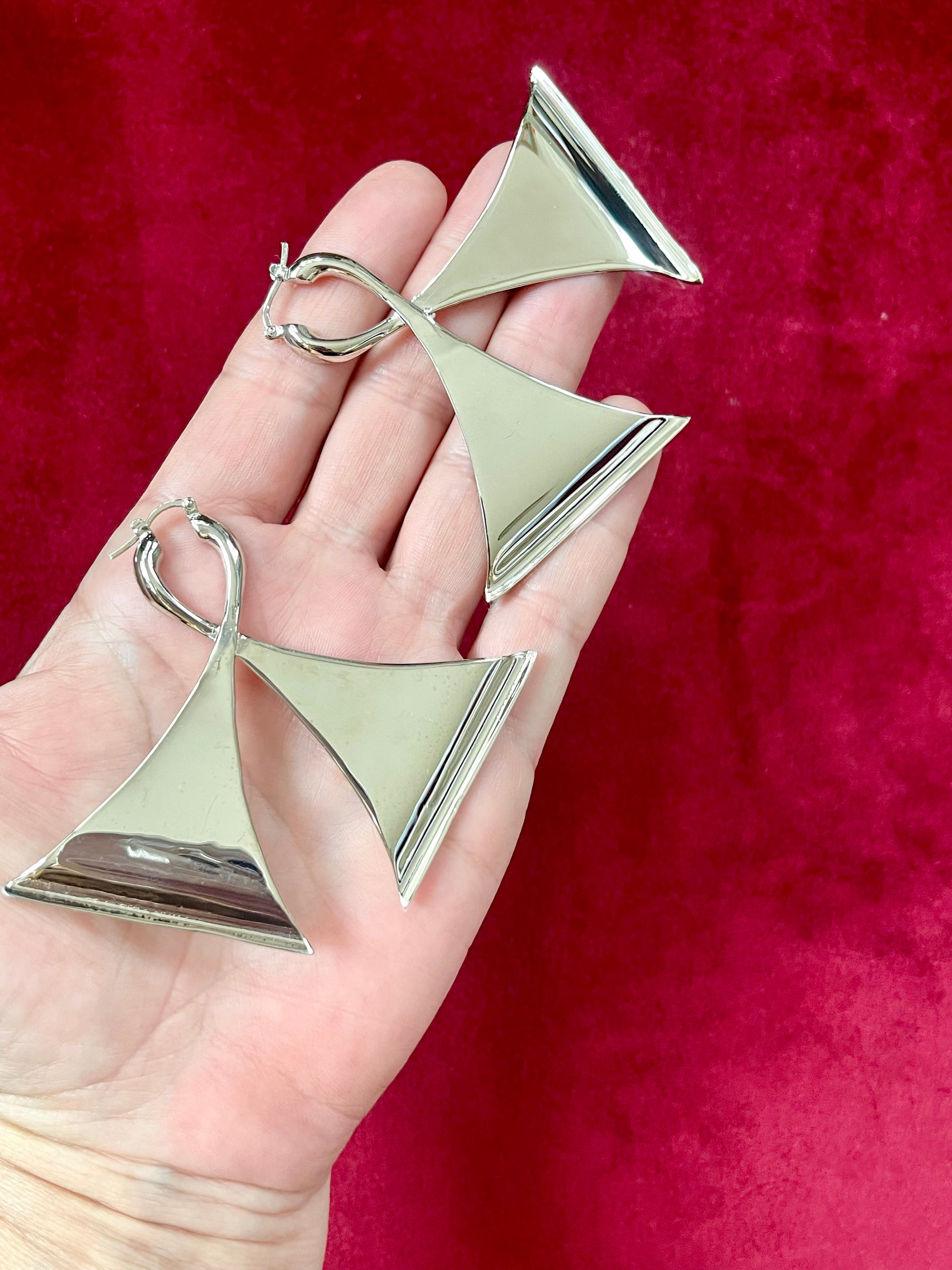 Vintage Paco Rabanne silver-tone geometric sculptural statement earrings Placed on hand showing backside 